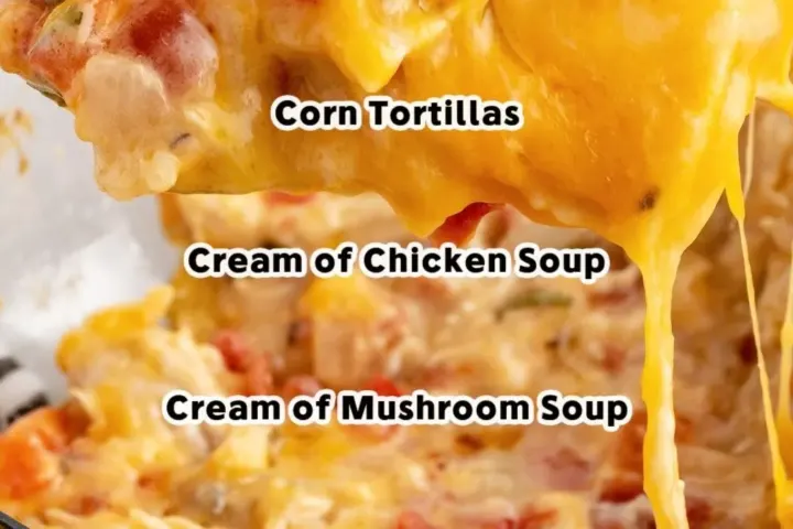 Scoop of King Ranch Chicken Casserole showing layers of chicken, cheese, Rotel, onion, and corn tortillas